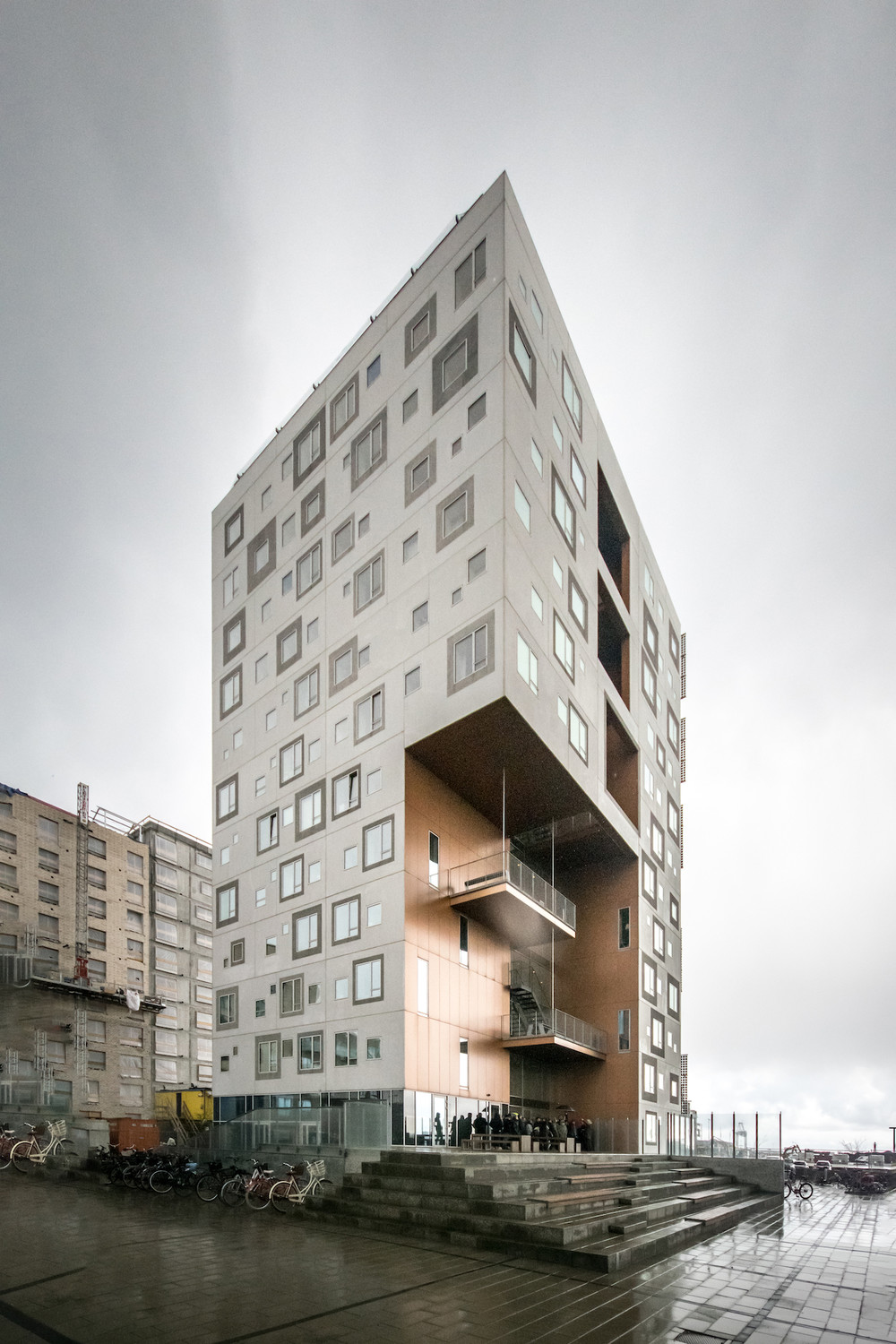 A white lighthouse with red top